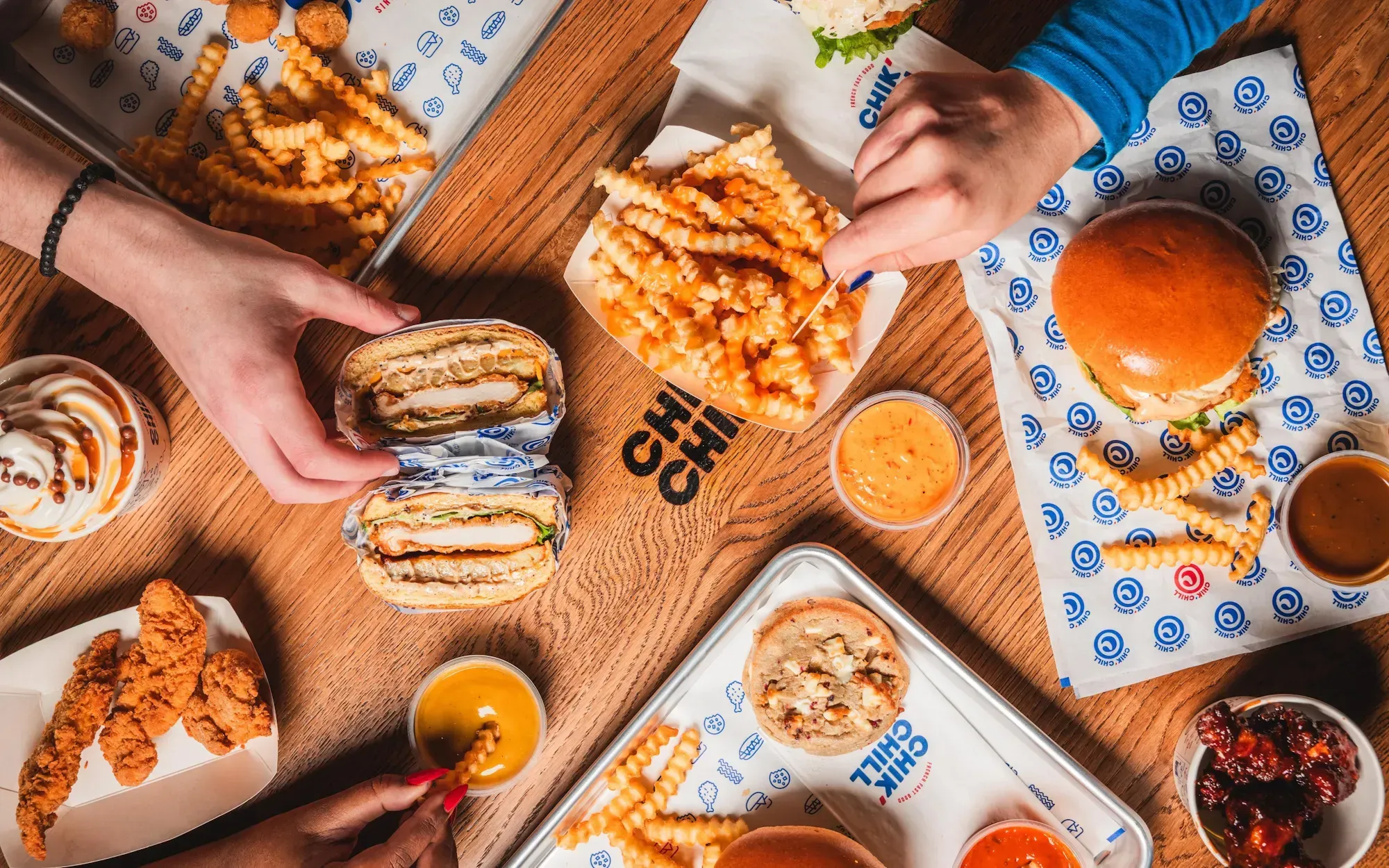 Chik’Chill’s fried chicken burgers and fries on a table