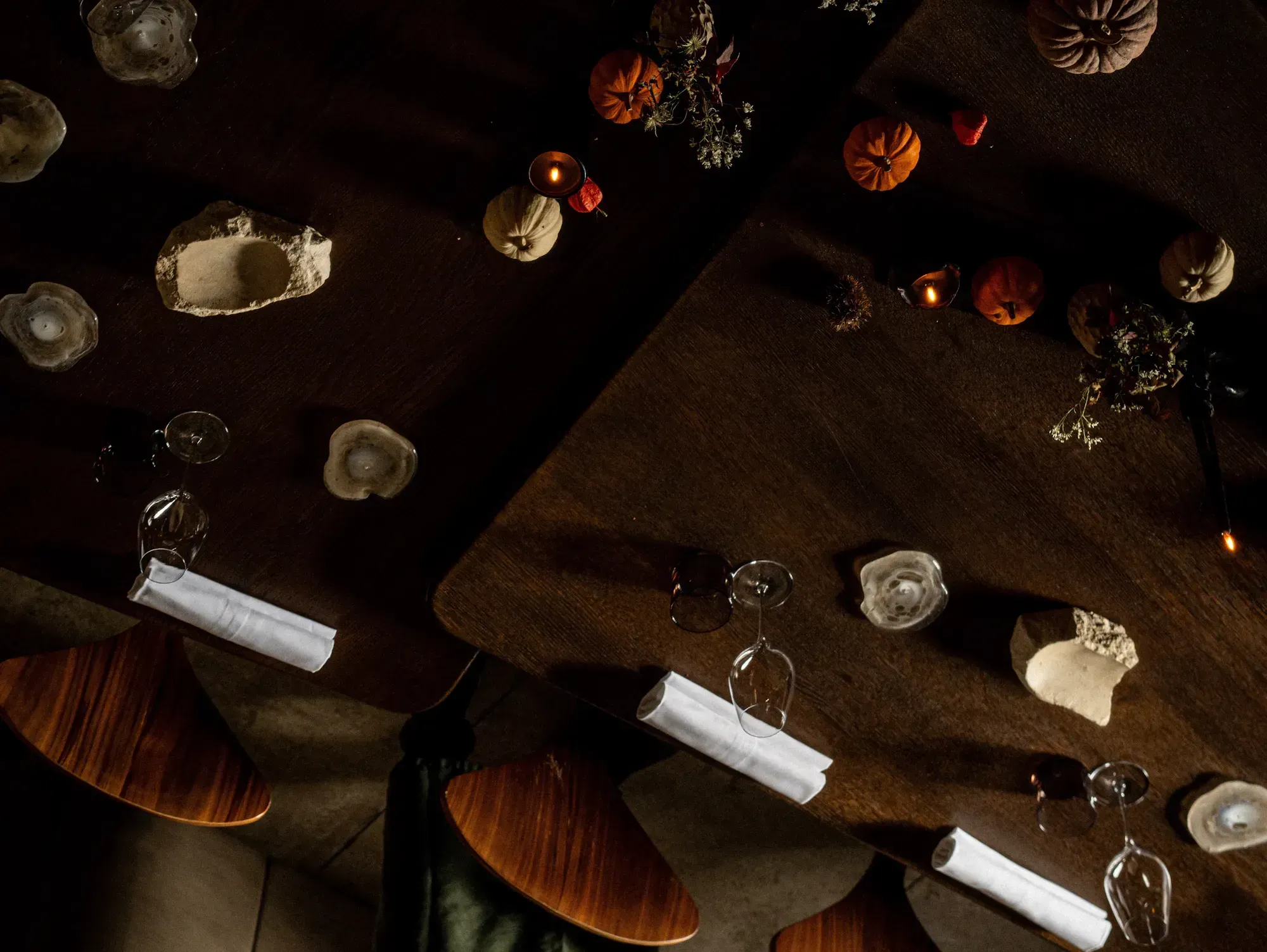 NHOMe’s tables laid under soft lighting